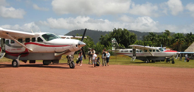 Cessna Caravans parked on the Annai Airstrip at the east gate of Rock View Lodge